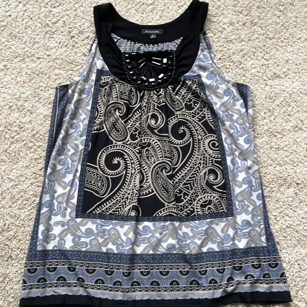 Notations woman's top size medium.